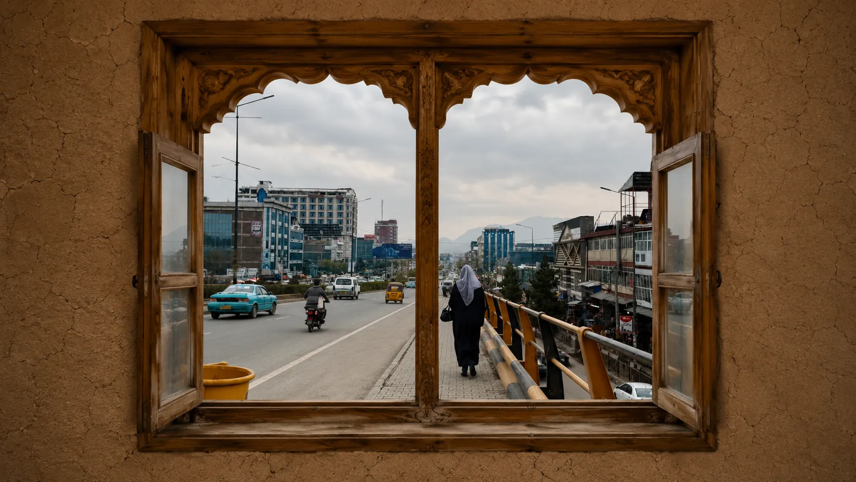 A carved Afghan window, its shutters open onto the hills and mosques of Kabul